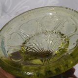 Old small cut on foot in yellow molded glass