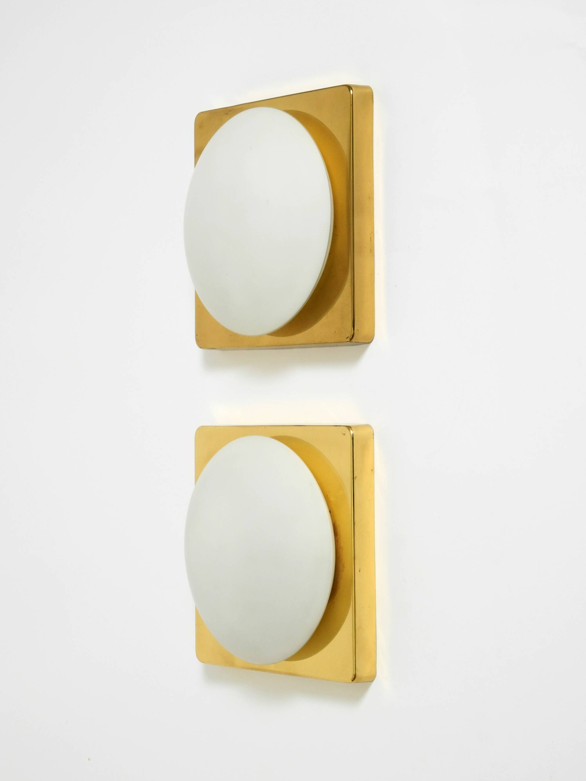 Two 1970s brass wall lamps by Rolf Krüger for Heinz Neuhaus Leuchten