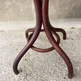 Pedestal table in curved wood
