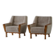 Modern Danish, a pair of easy chairs in oak and lamb's wool, Henning Kjærnulf, 1960s.