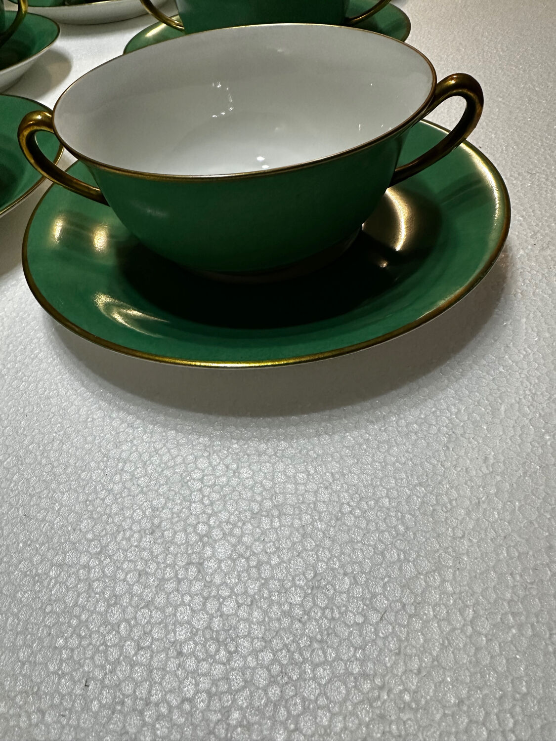 Service 14 cup and saucer in Art Deco Emerald Green and Gold.