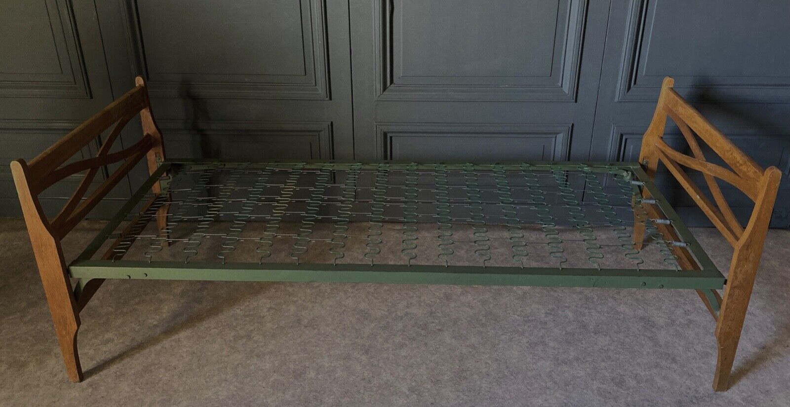 Bed with green metal braces 1960 a person foldable