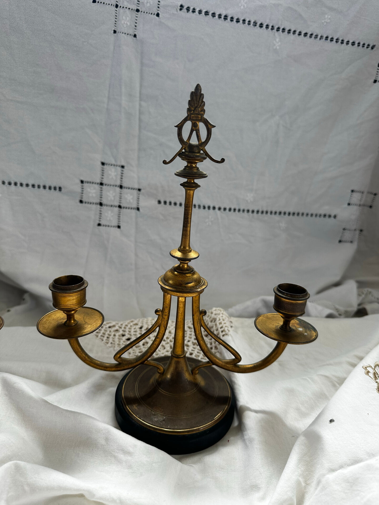 Pair of Empire style candlesticks, patinated brass and black stone.
