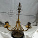 Pair of Empire style candlesticks, patinated brass and black stone.