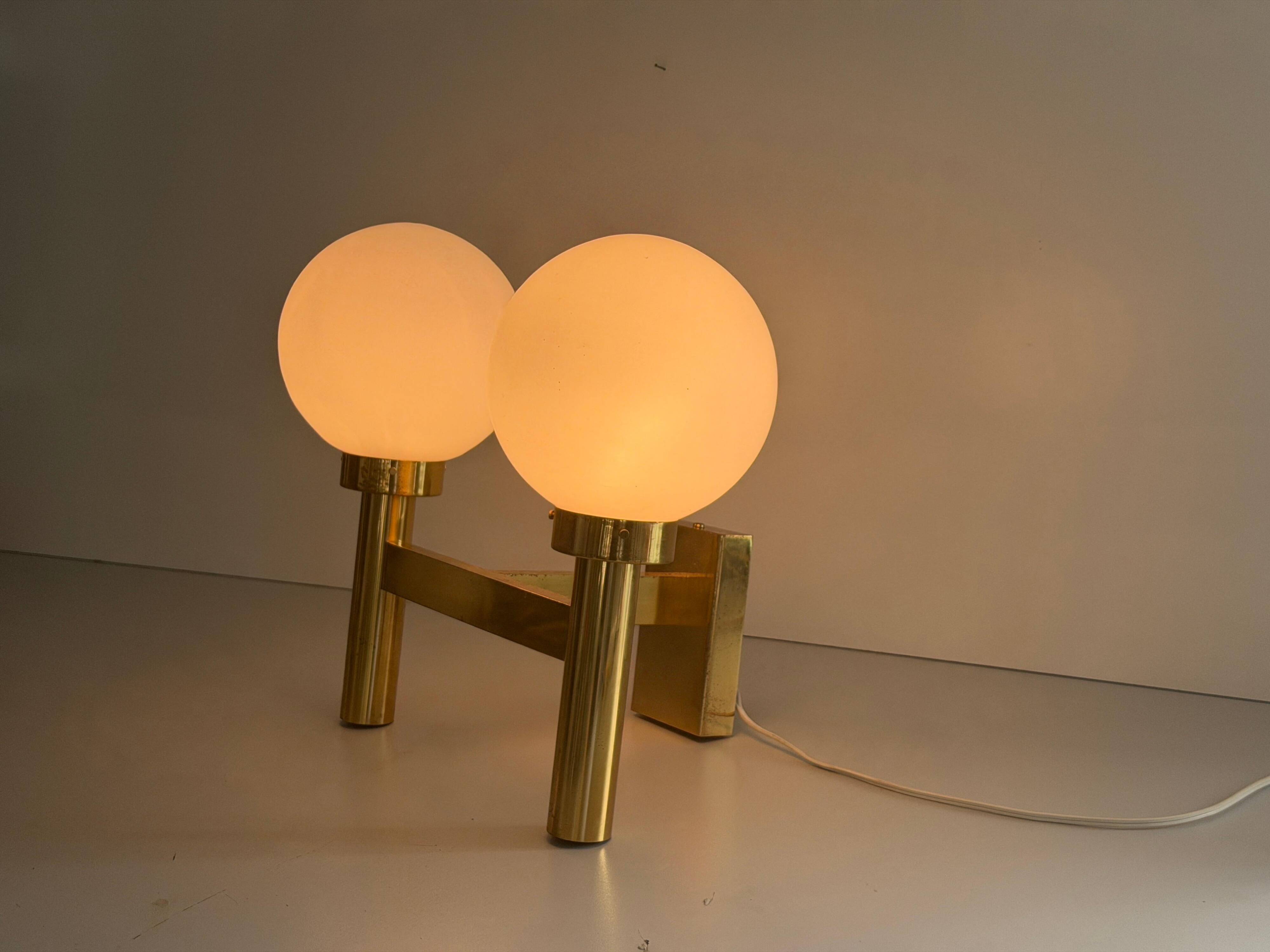Double opal glass and heavy brass, large minimalist cinema wall light, 1960s, Germany