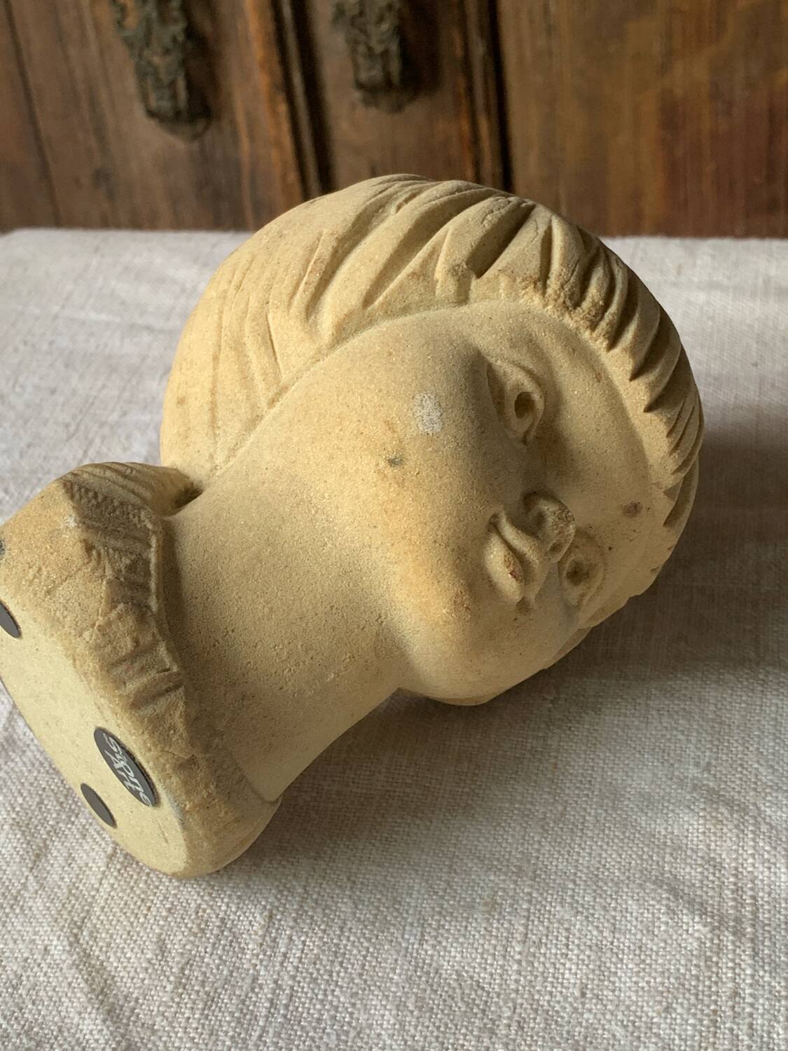 Stone bust of a little girl