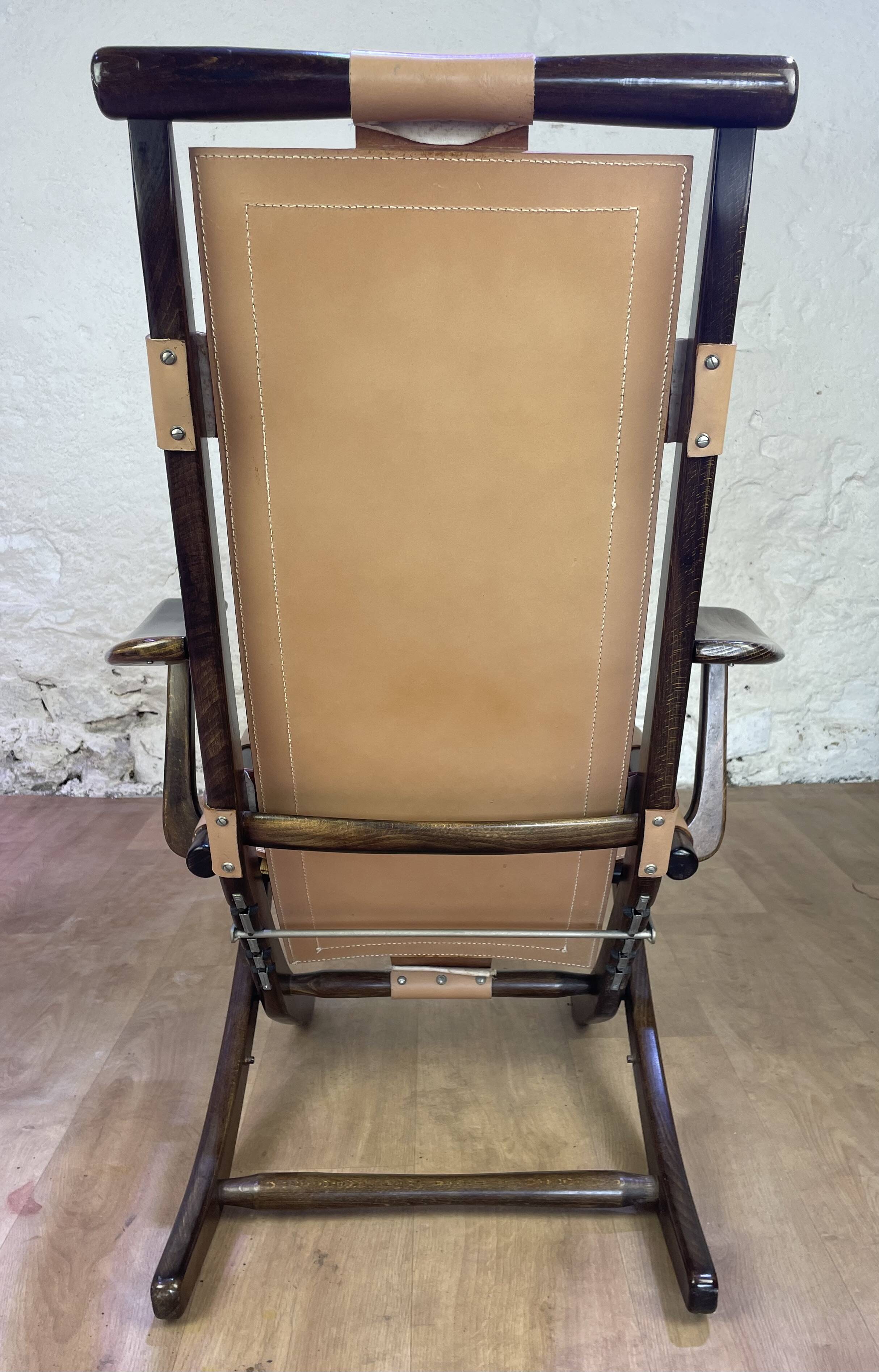 Colonial style leather armchair and ottoman