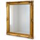 Antique mirror with a gilded frame and foliage decoration.