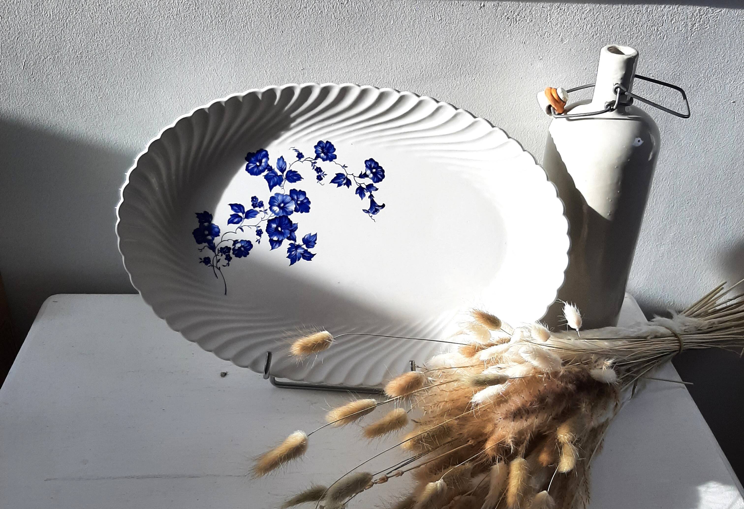 Keller and Guérin Lunéville serving dish with blue flowers on a white background.