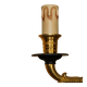 Pair of L'Originale wall sconces plated with 24-carat gold featuring four bronze candles.