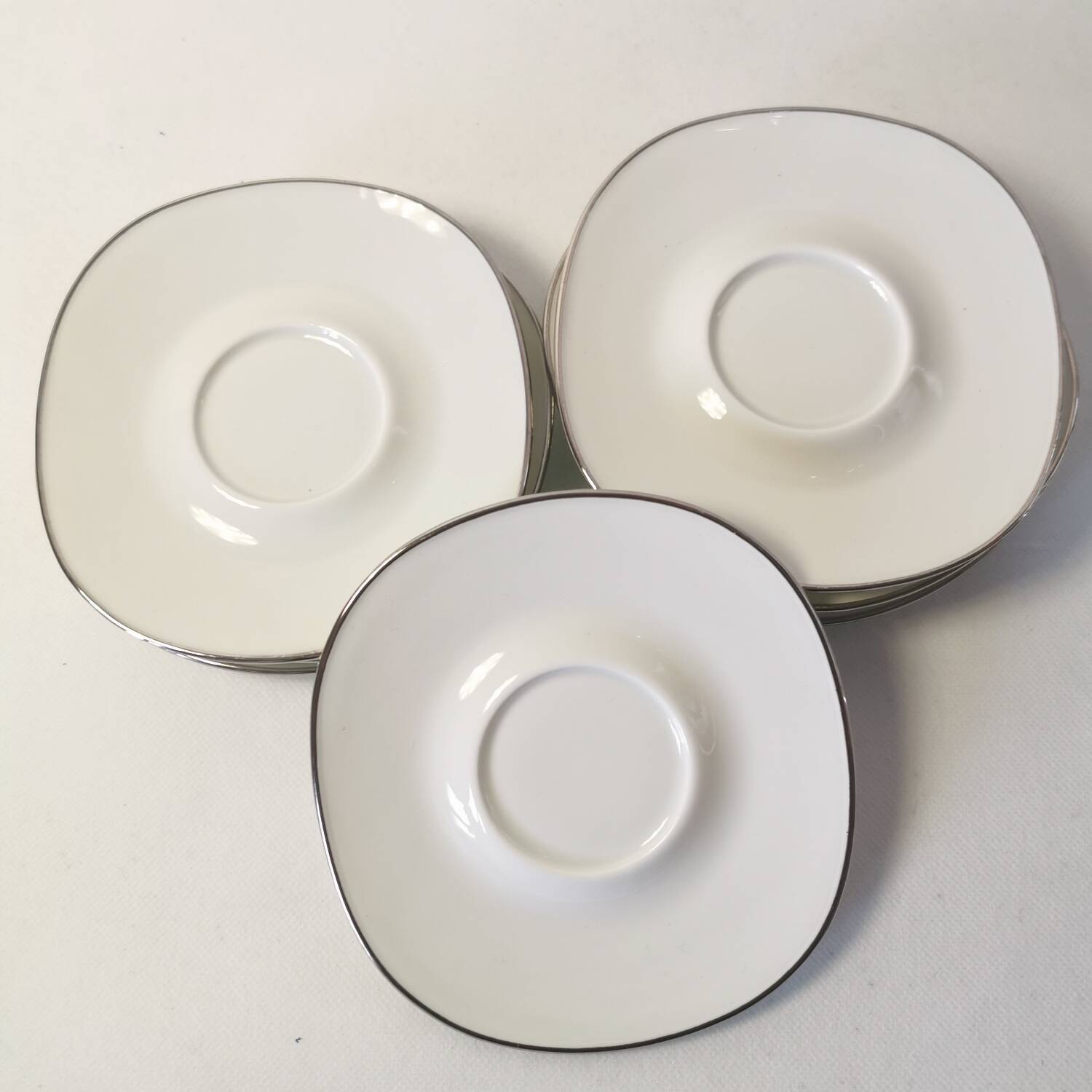 Set of 8 Georges Boyer Limoges porcelain saucers