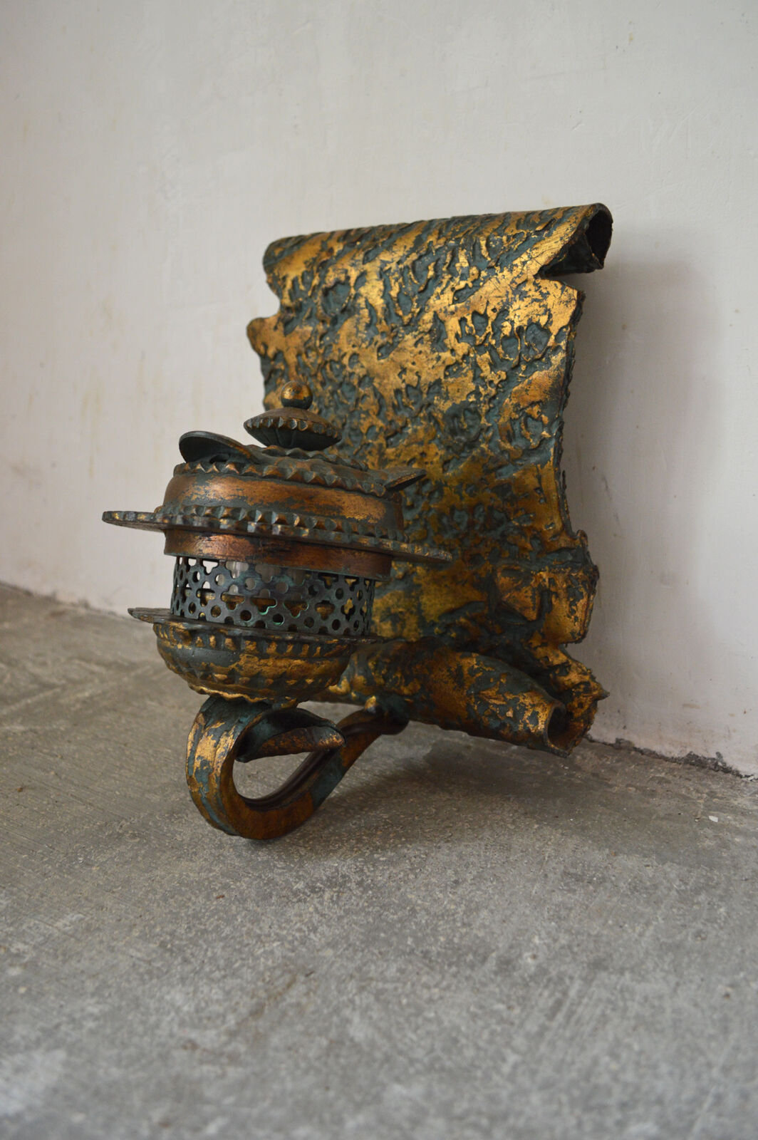 Pair of patinated wrought iron sconces