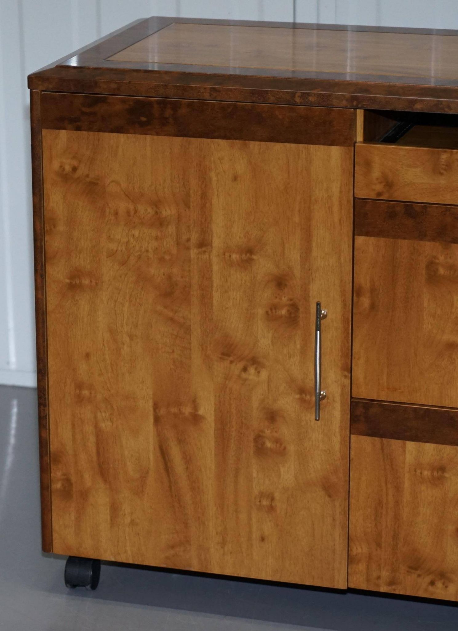 Walnut Burr buffet with drawers and wheels, part of a set.