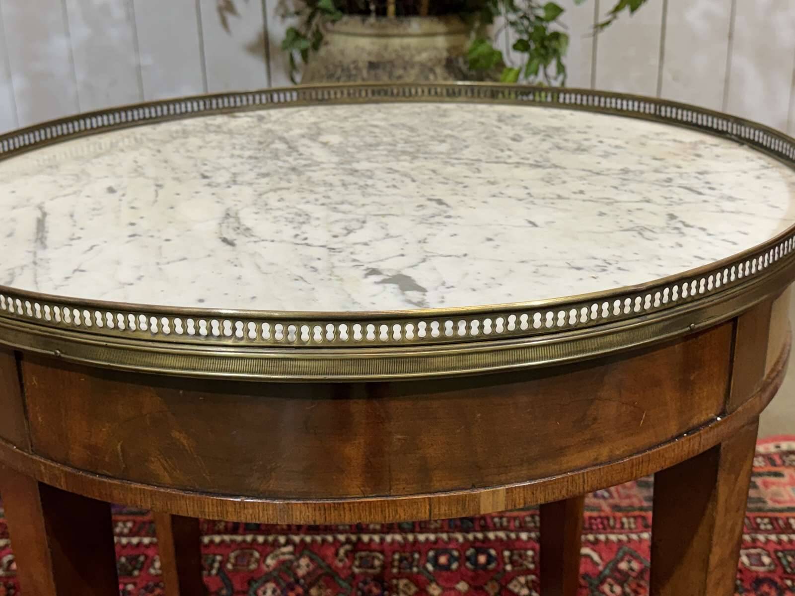 Louis XVI style bouillotte table in mahogany with a white marble top.