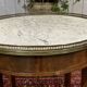 Louis XVI style bouillotte table in mahogany with a white marble top.