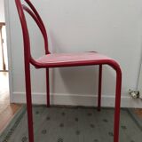 Red lacquered tubular chair