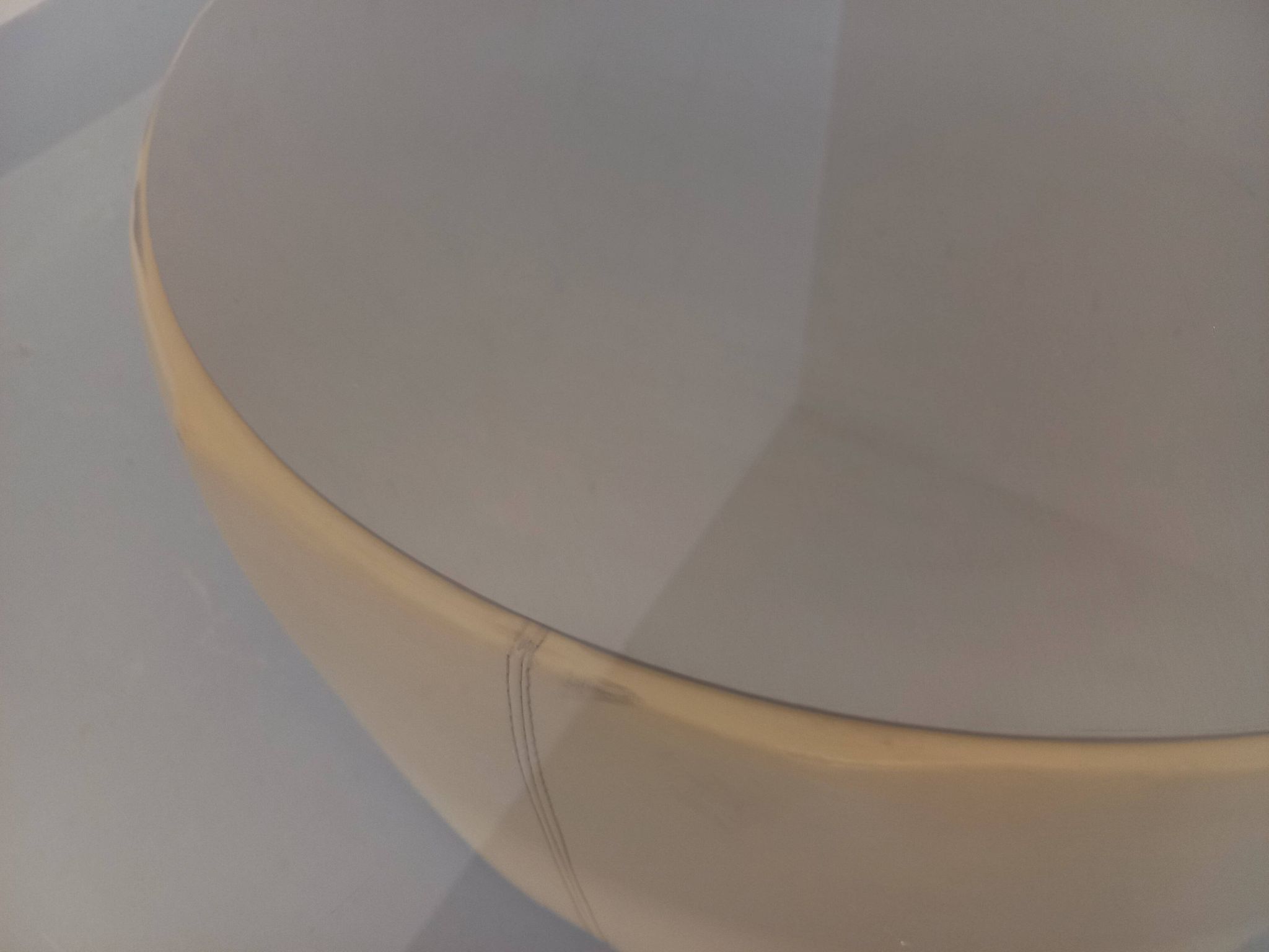 Vintage round coffee table in glass, leather, and metal in Space Age style from the 70s.