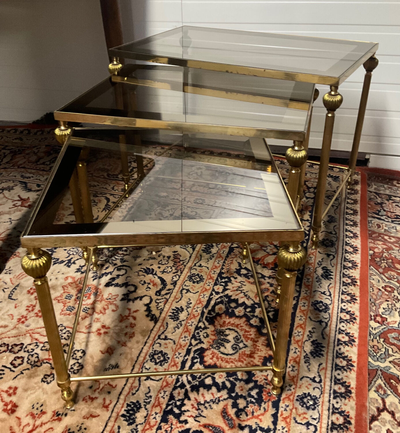 Series of 3 empire style nesting tables in brass and glass