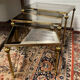 Series of 3 empire style nesting tables in brass and glass