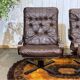Pair of Norwegian swivel armchairs in leather and beech from the 1970s.