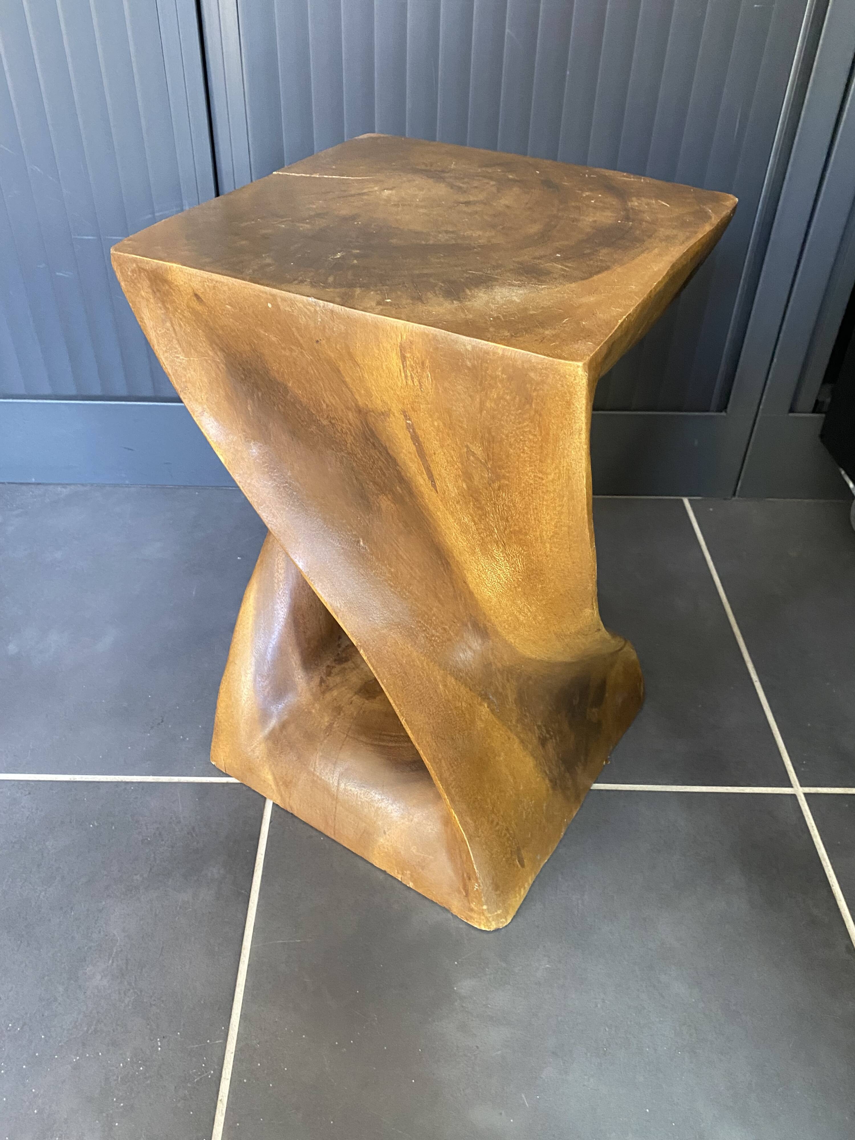 Stool no. 1 in solid raw walnut wood, carved from the mass, 1970.