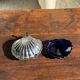 Vintage silver-plated shell butter dish with blue bowl.