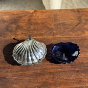 Vintage silver-plated shell butter dish with blue bowl.