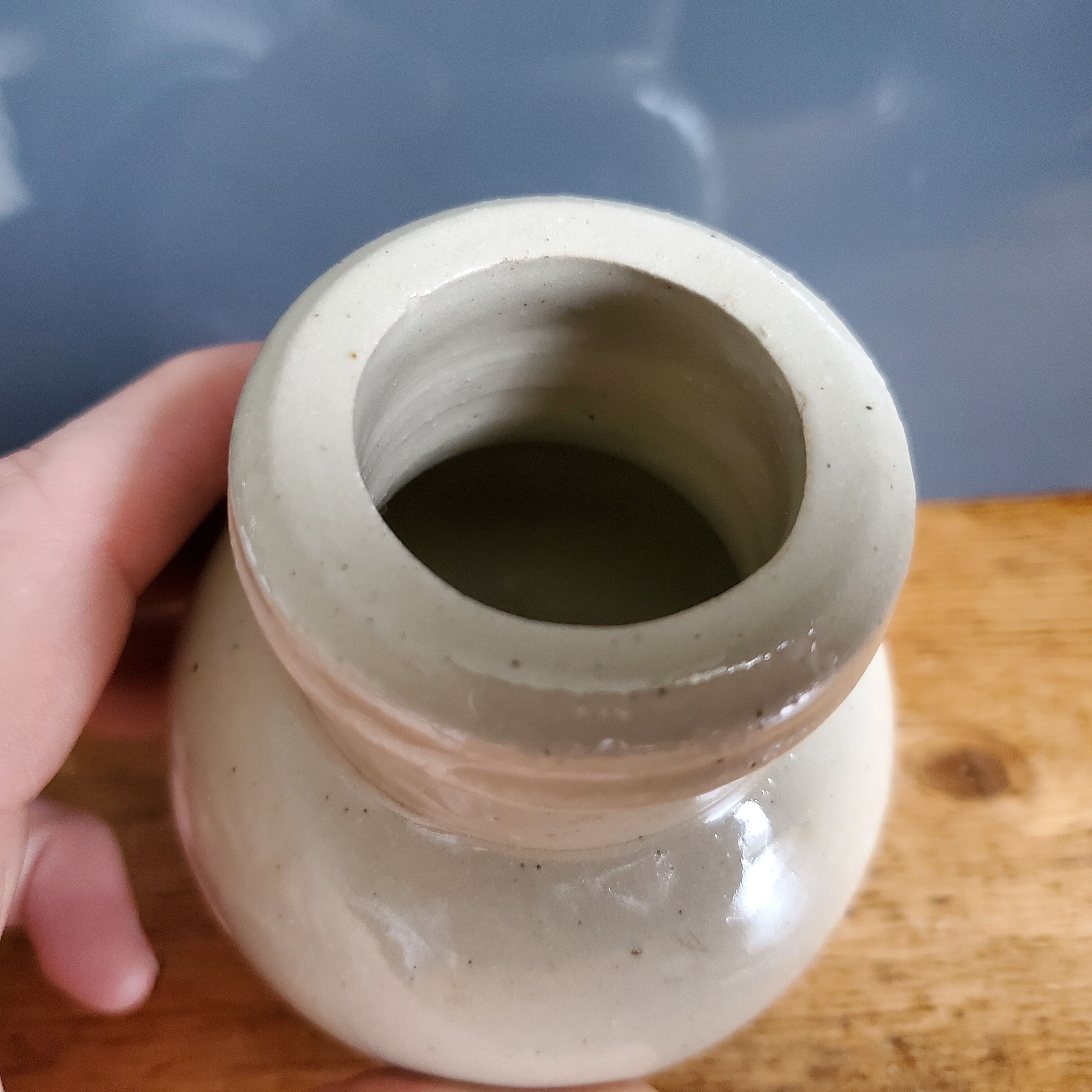 Small beige ball vase in glazed sandstone