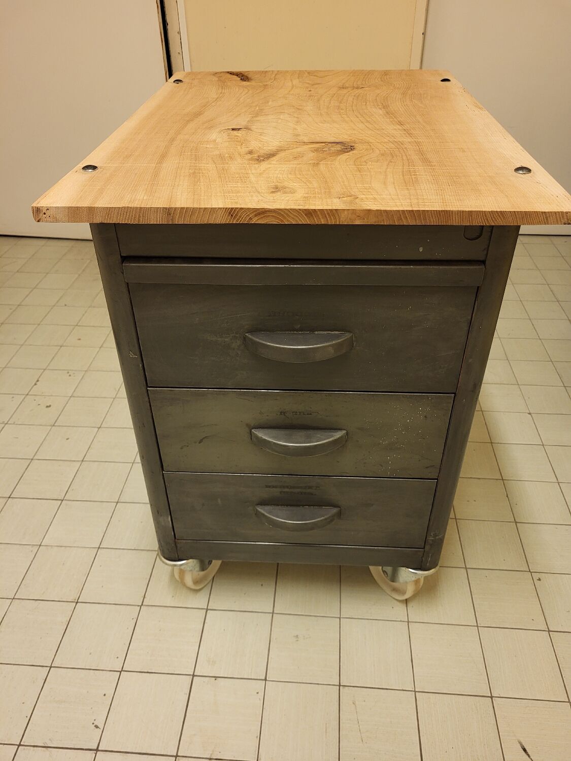 Wood and waxed metal furniture on casters
