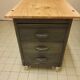 Wood and waxed metal furniture on casters