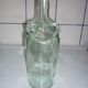 Old transparent moulded glass bottle
