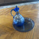 Set of a carafe with its blue glass tray.