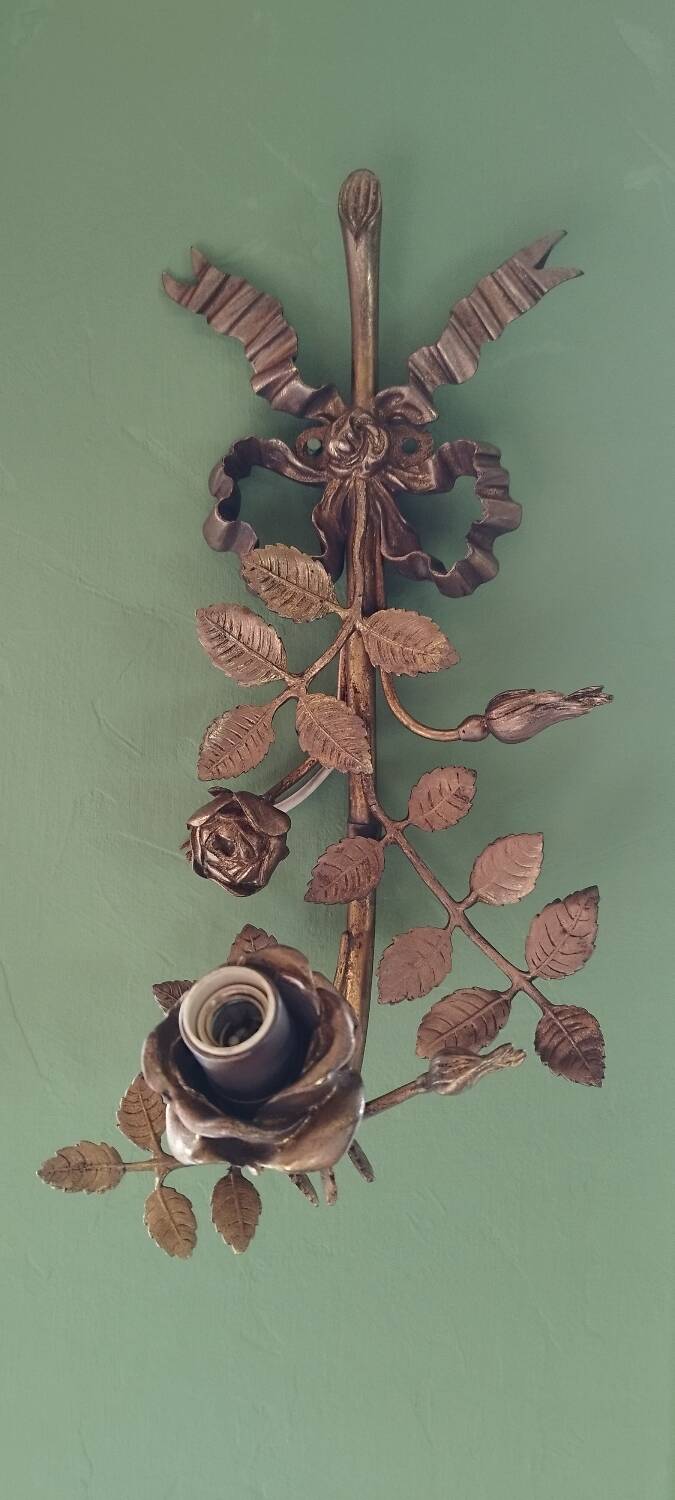 Bronze and gilded metal wall sconce in Louis XVI style.