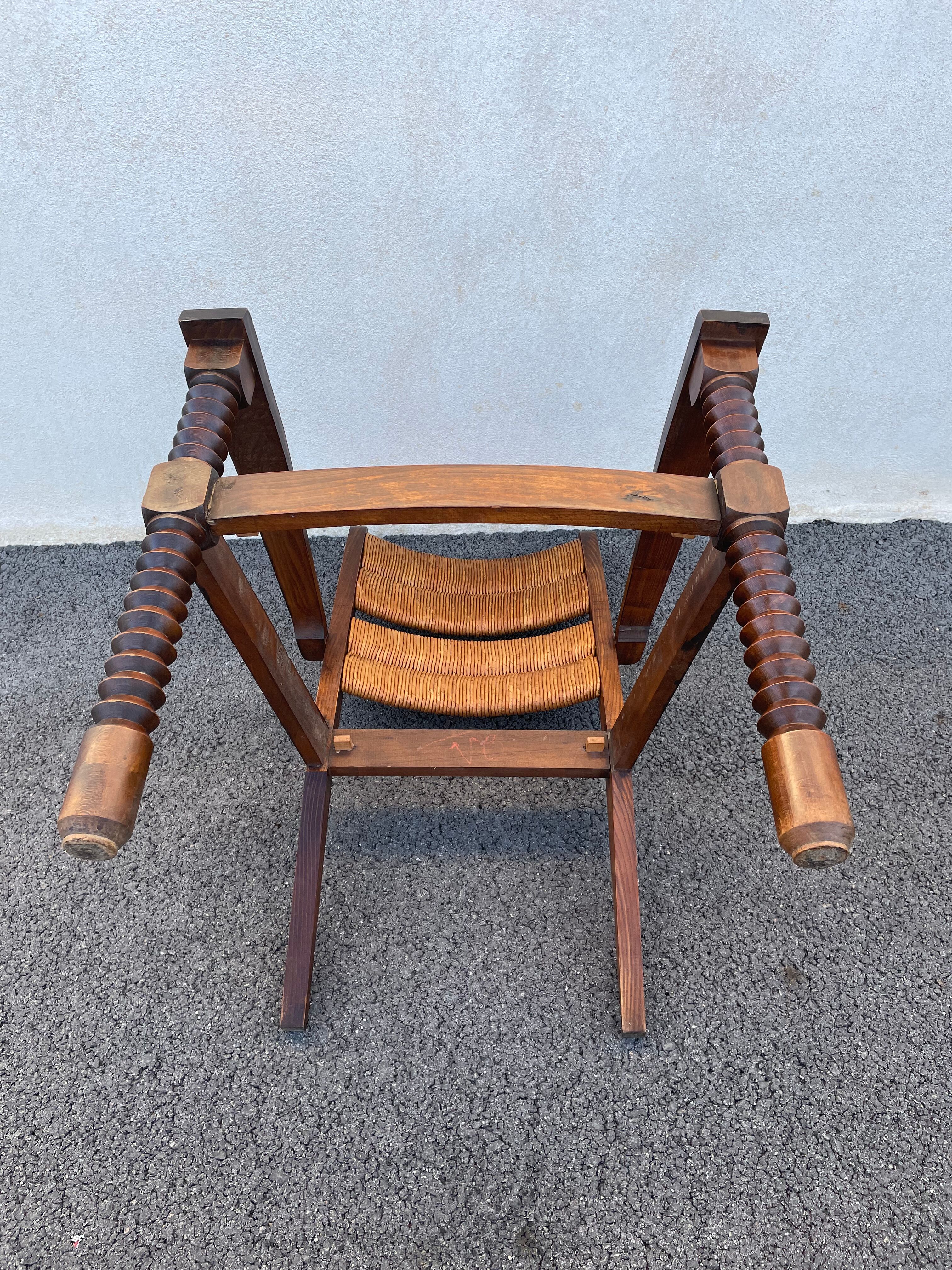 Vintage armchair in straw and brutalist wood