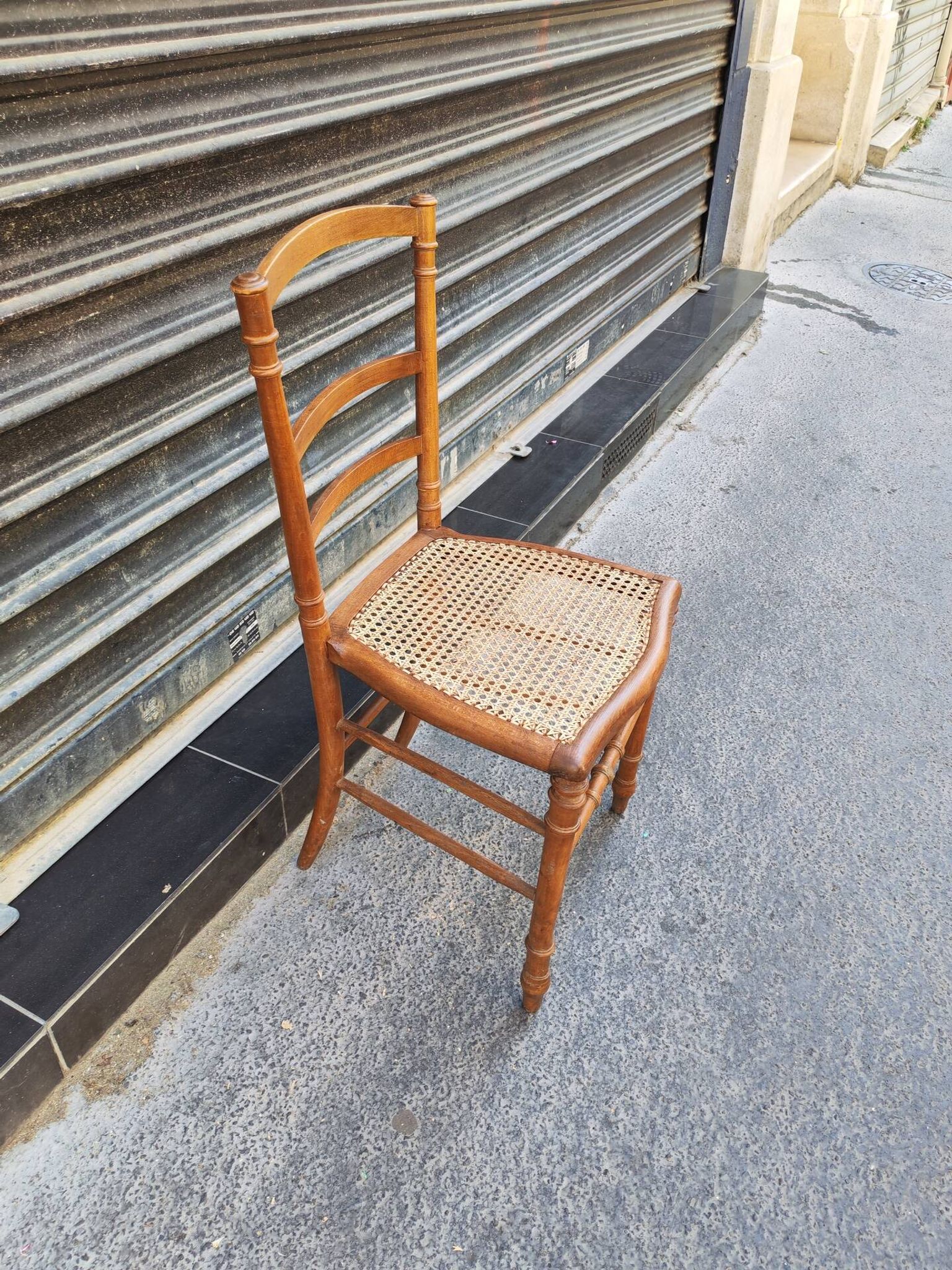 Antique wooden chair with cane seating