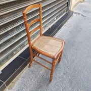 Antique wooden chair with cane seating