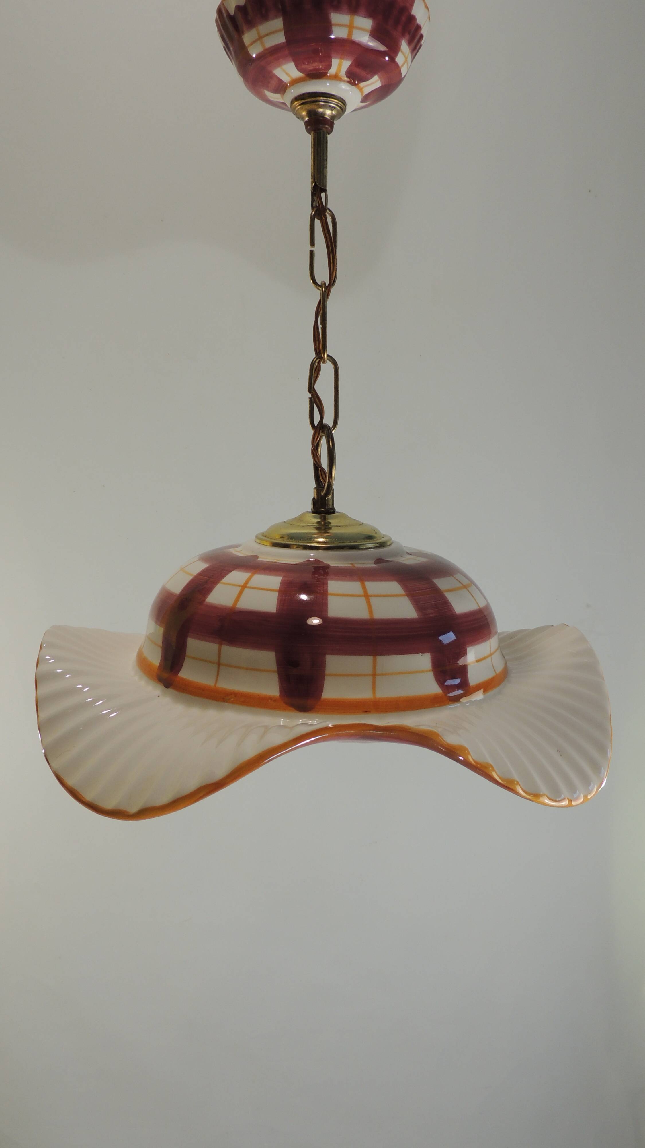 Vintage earthenware pendant light with a burgundy and ochre tartan pattern