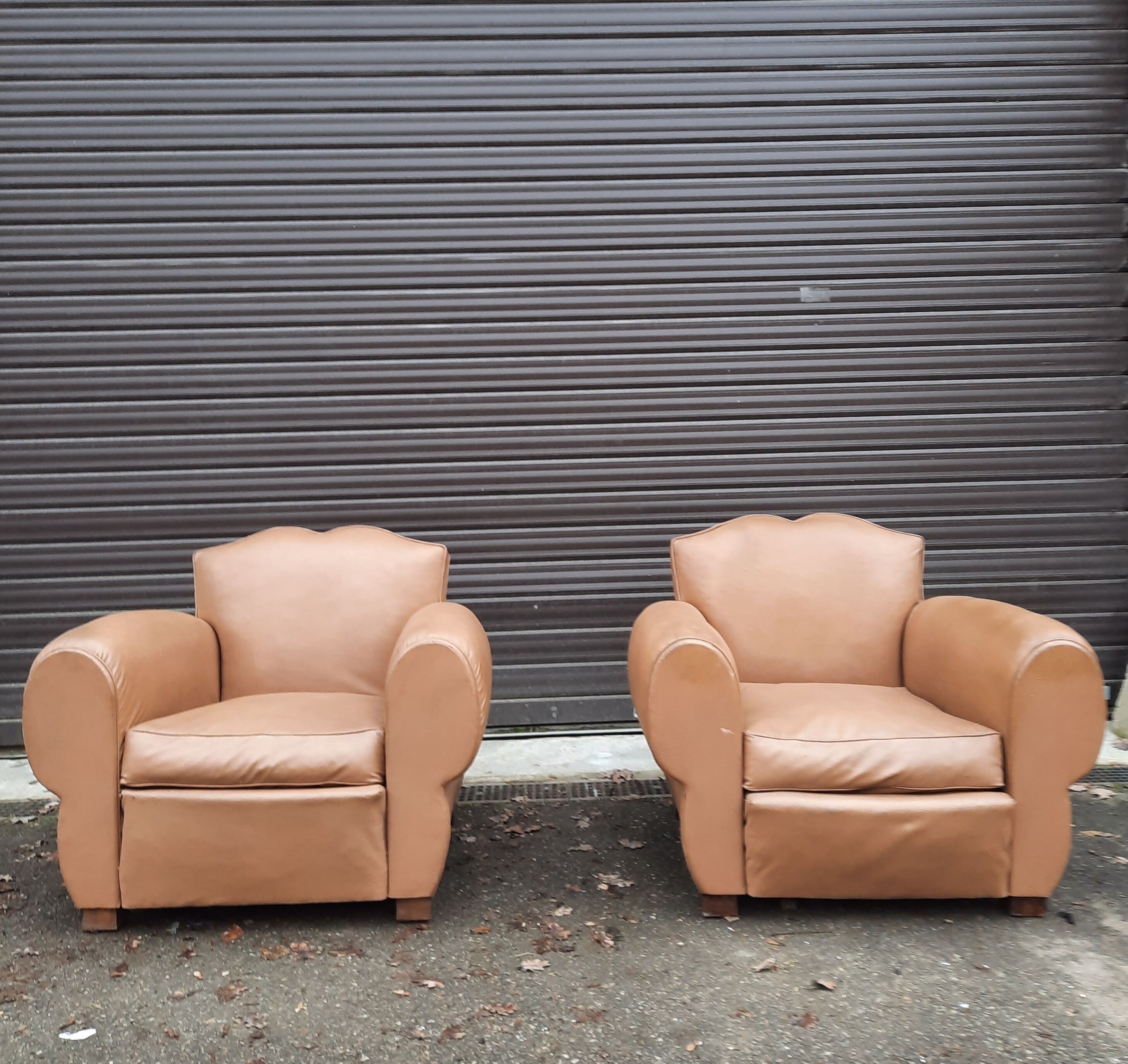 Pair of club chairs in skai