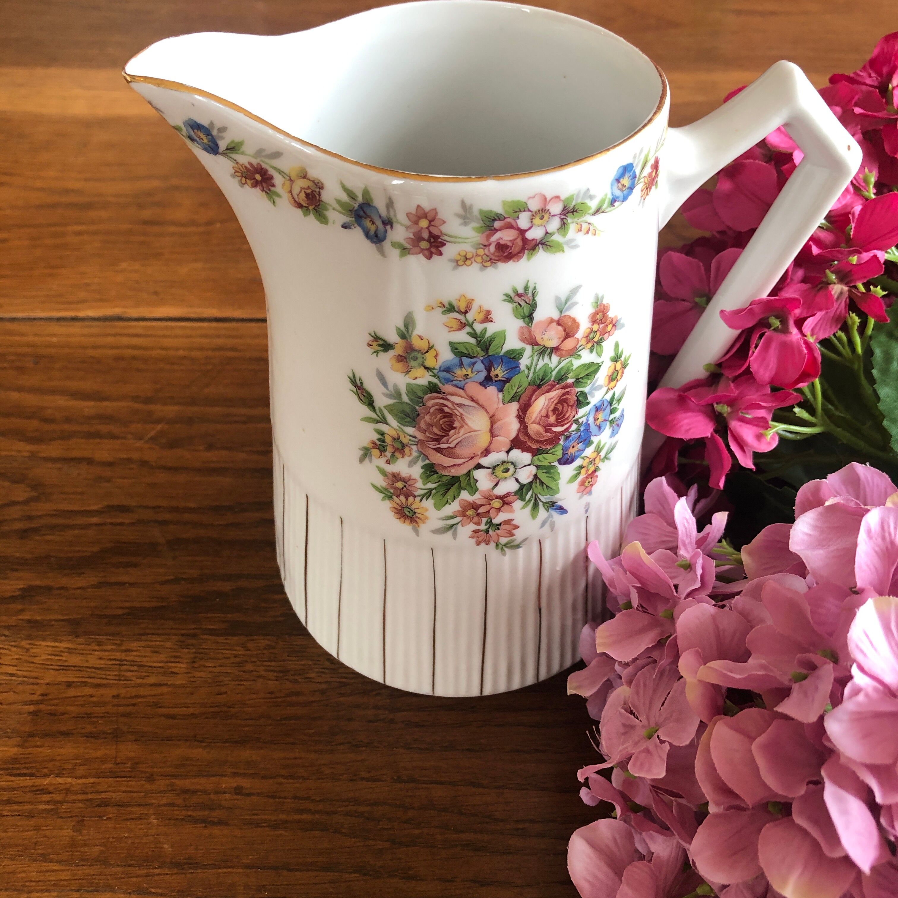 Porcelain pitcher with flowers
