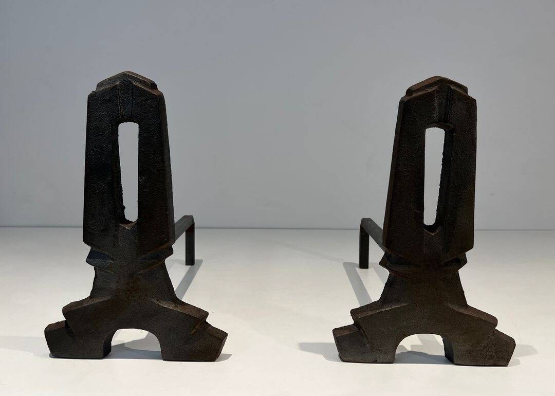 Pair of Modernist Andirons in Cast Iron with Openwork Uprights and Tripod Bases