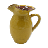 Yellow ceramic pitcher