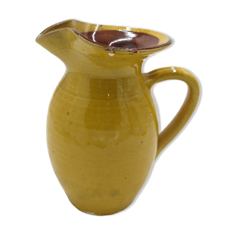 Yellow ceramic pitcher