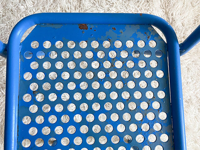 Pair of perforated metal garden chairs
