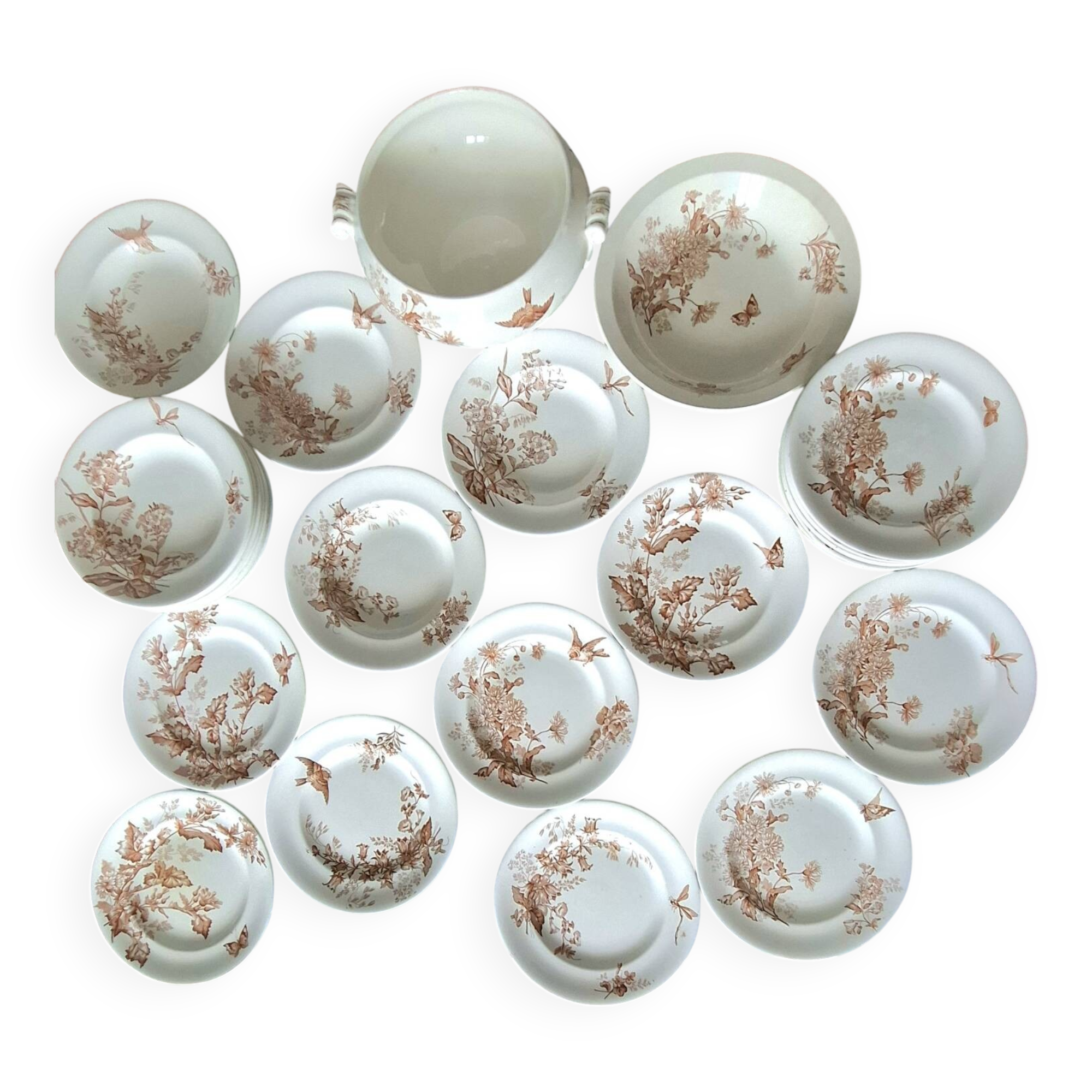 Antique iron earthenware plates accompanied by dishes