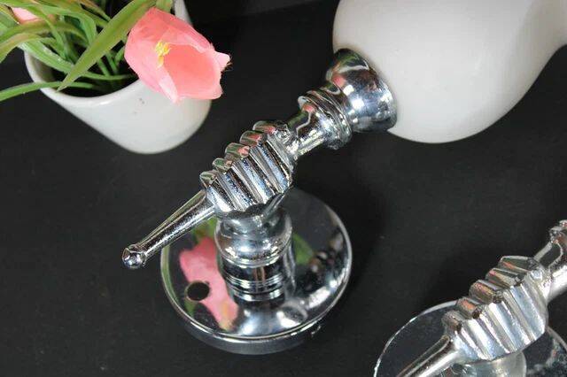 Pair of chrome-plated metal wall lights, hand-shaped with lampshade