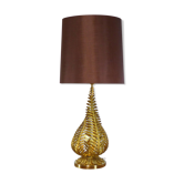 Lamp to lay on the foliage of golden ferns