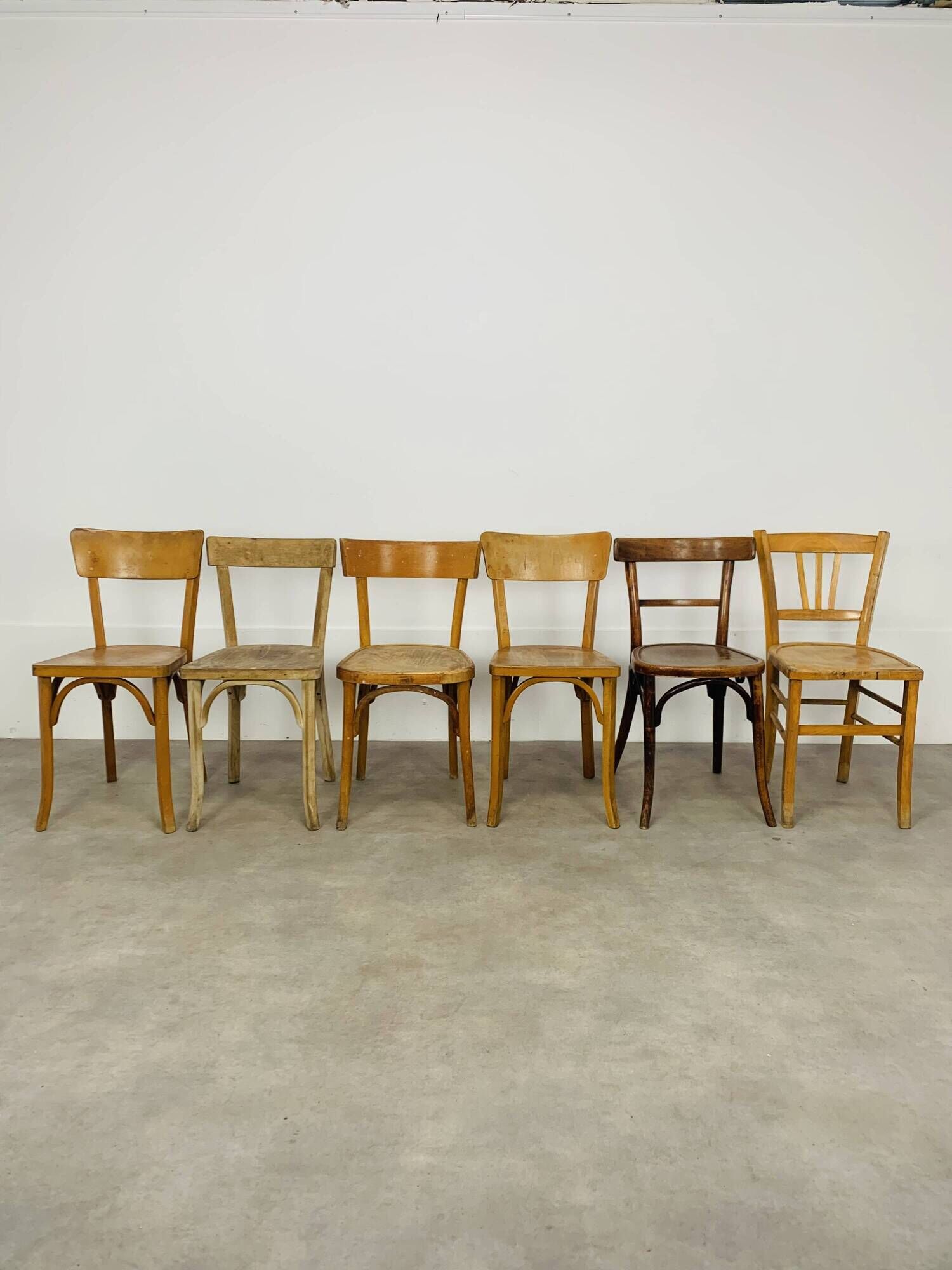 6 mismatched Baumann & Luterma bistro chairs, wood, 1960s