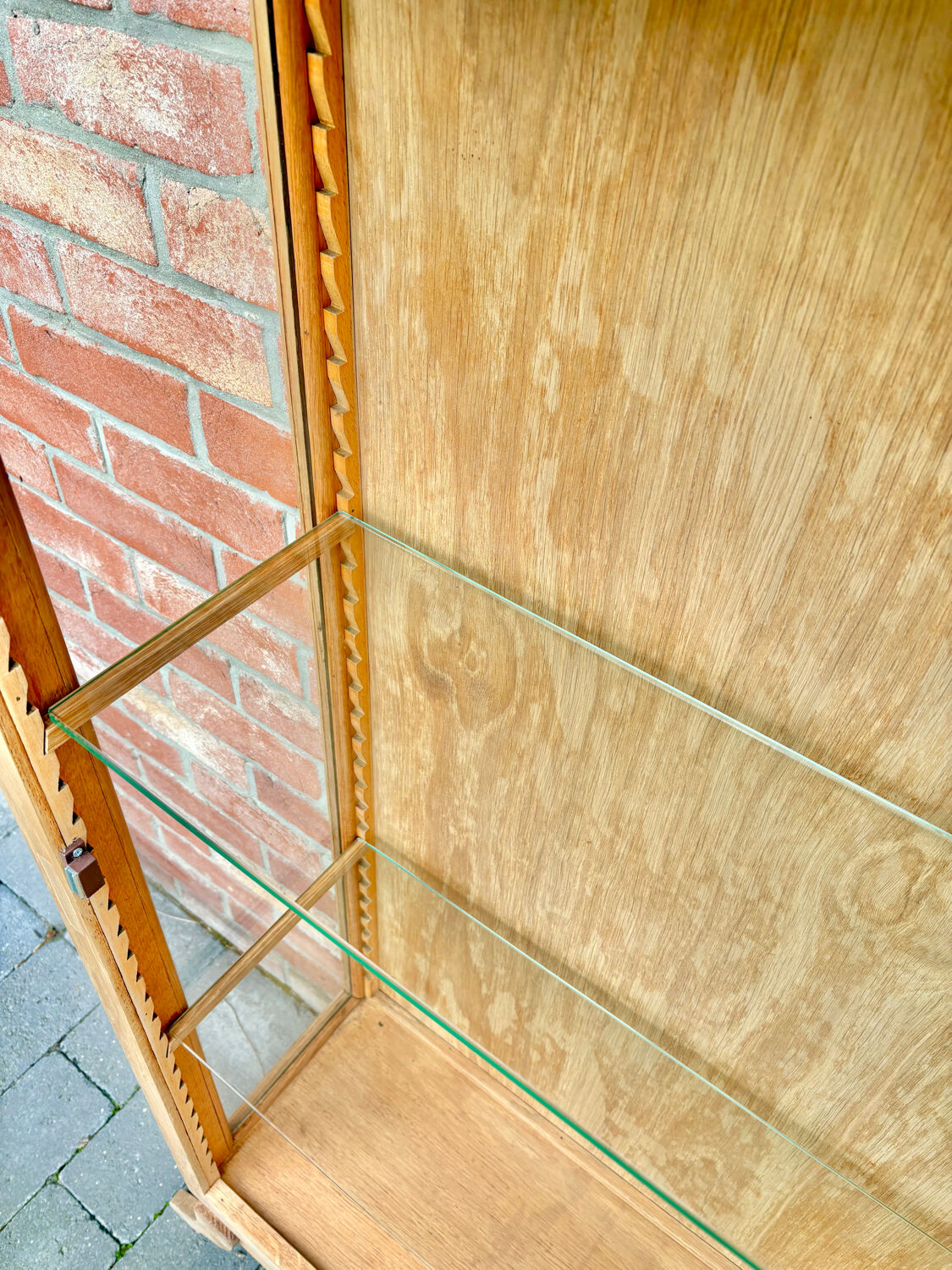 Restored antique oak display cabinet with glass shelves.