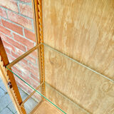 Restored antique oak display cabinet with glass shelves.