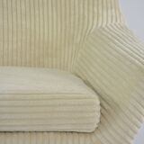 Cream corduroy swivel shell armchairs